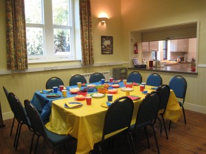 Tables laid for a Children's Birthday Tea in the Committee Room
