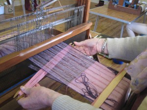 Close-up of making a herringbone weave